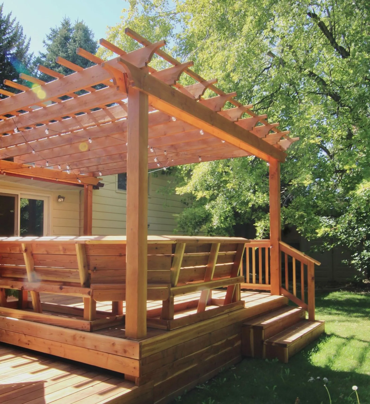 Beautiful redwood deck with built-in seating and pergola.